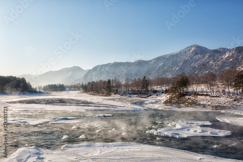 Winter landscape. Katun river in Altai on a sunny day. Russia