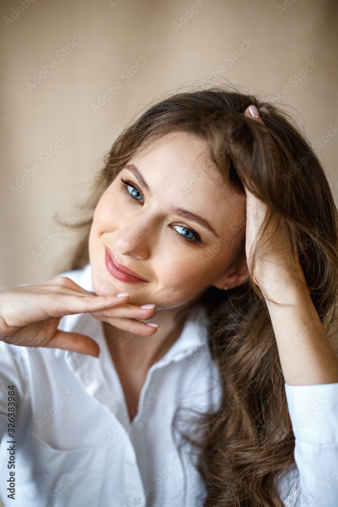 Portrait of a beautiful brunette woman in office clothes. Business woman concept Portrait of a beautiful brunette woman in office clothes. Business woman concept