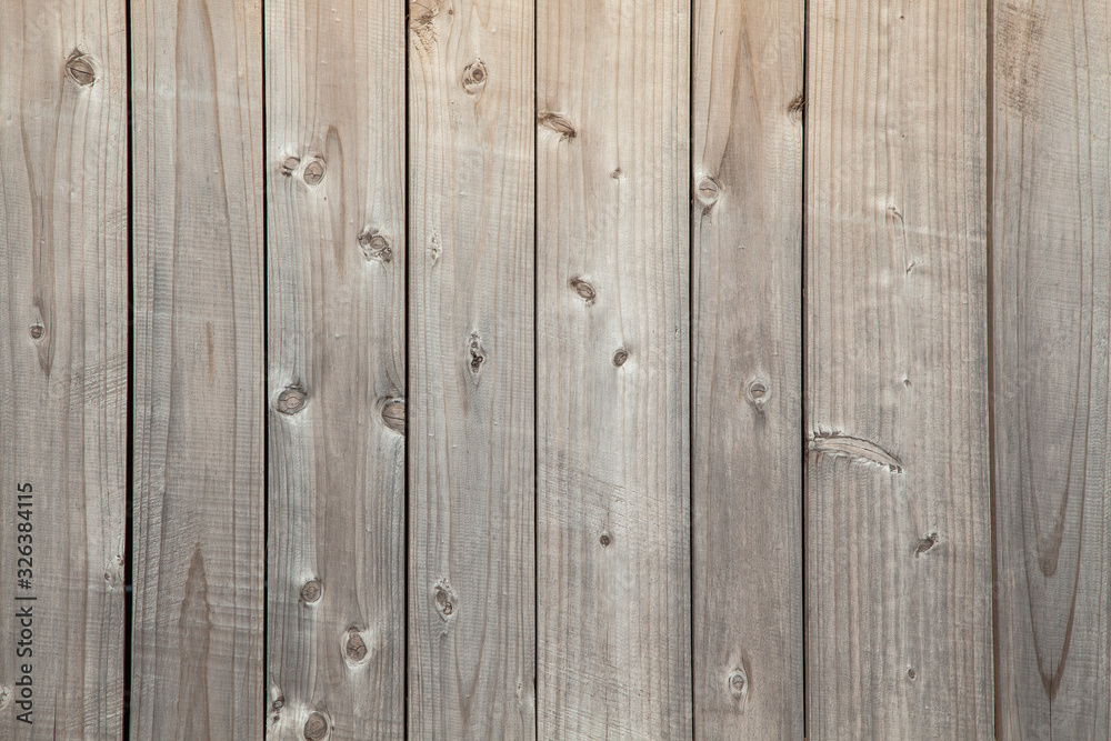 Natural background with unpainted weathered wooden boards Natural background with unpainted weathered wooden boards
