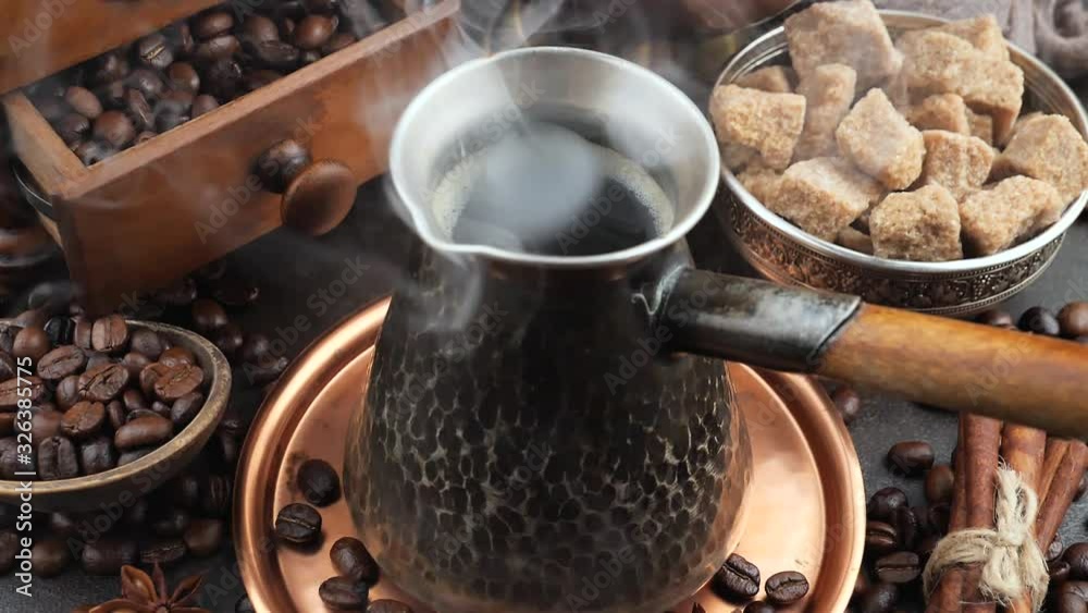 Hot black coffee in a coffee maker with a smoke Hot black coffee in a coffee maker with a smoke