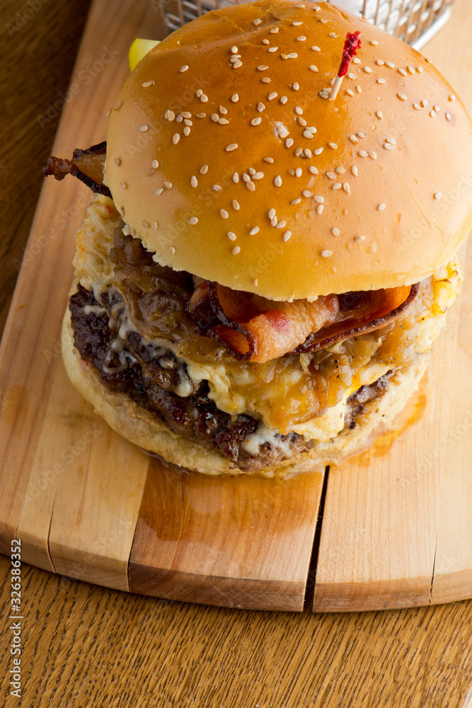 Bacon Cheeseburger with swiss cheese. open faced burger. Traditional