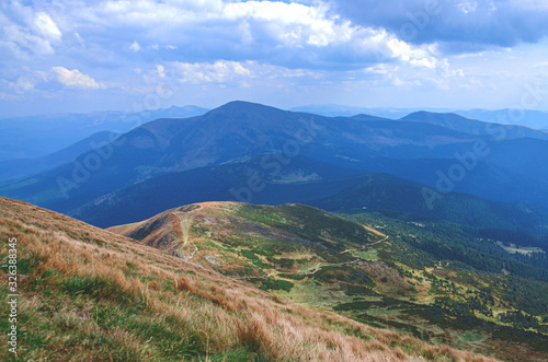 Conquering the mountain peaks. Hike on the mountain hedges of the Carpathian Mountains