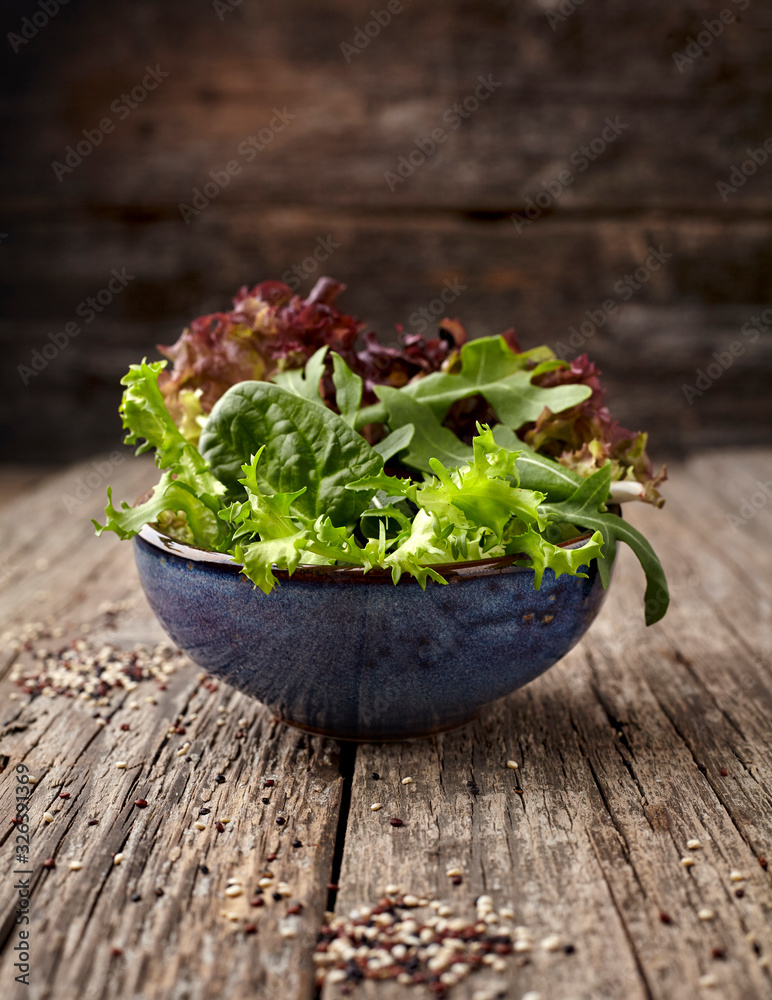 Green salad on wooden background Green salad on wooden background