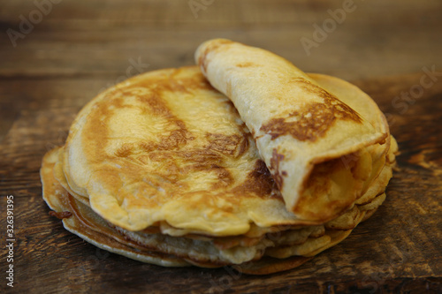 close-up homemade pancakes on a wooden rustic board photo