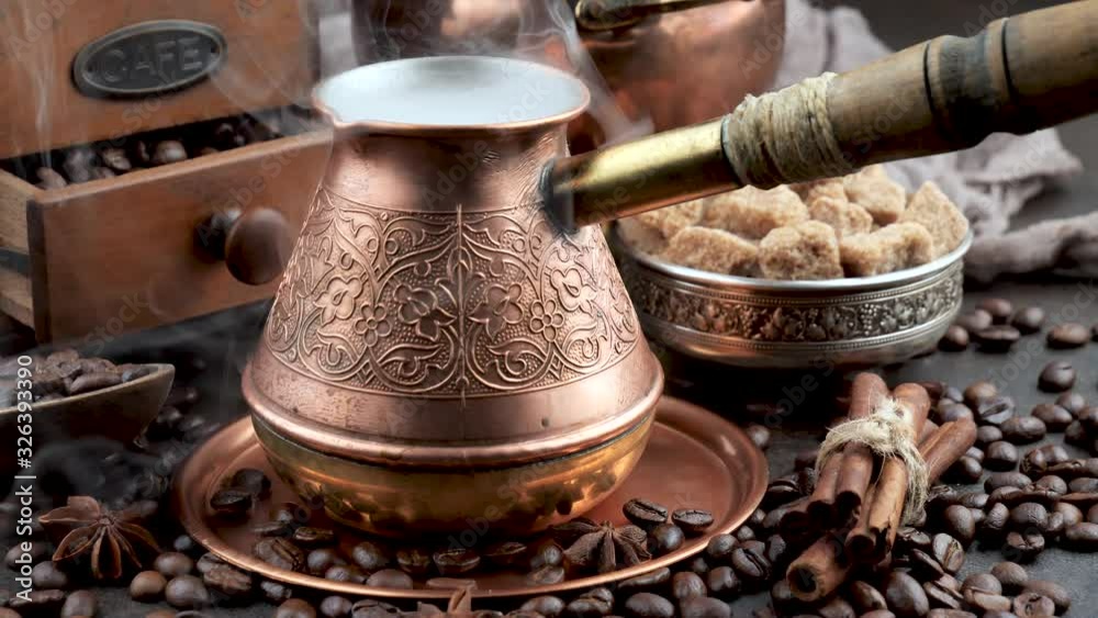 Hot black coffee in a coffee maker with a smoke Hot black coffee in a coffee maker with a smoke