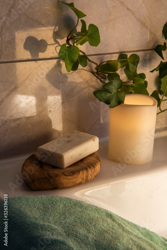soap and towel on bathroom sink 