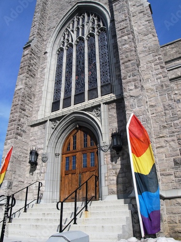 Rainbow banner welcomes LGBTQ parishoners to a Gothic church