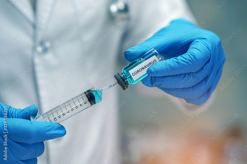 Fototapeta premium Novel Coronavirus (2019-nCoV) vaccine development medical with syringe for doctor use to treat pneumonia illness patients at Wuhan, China.