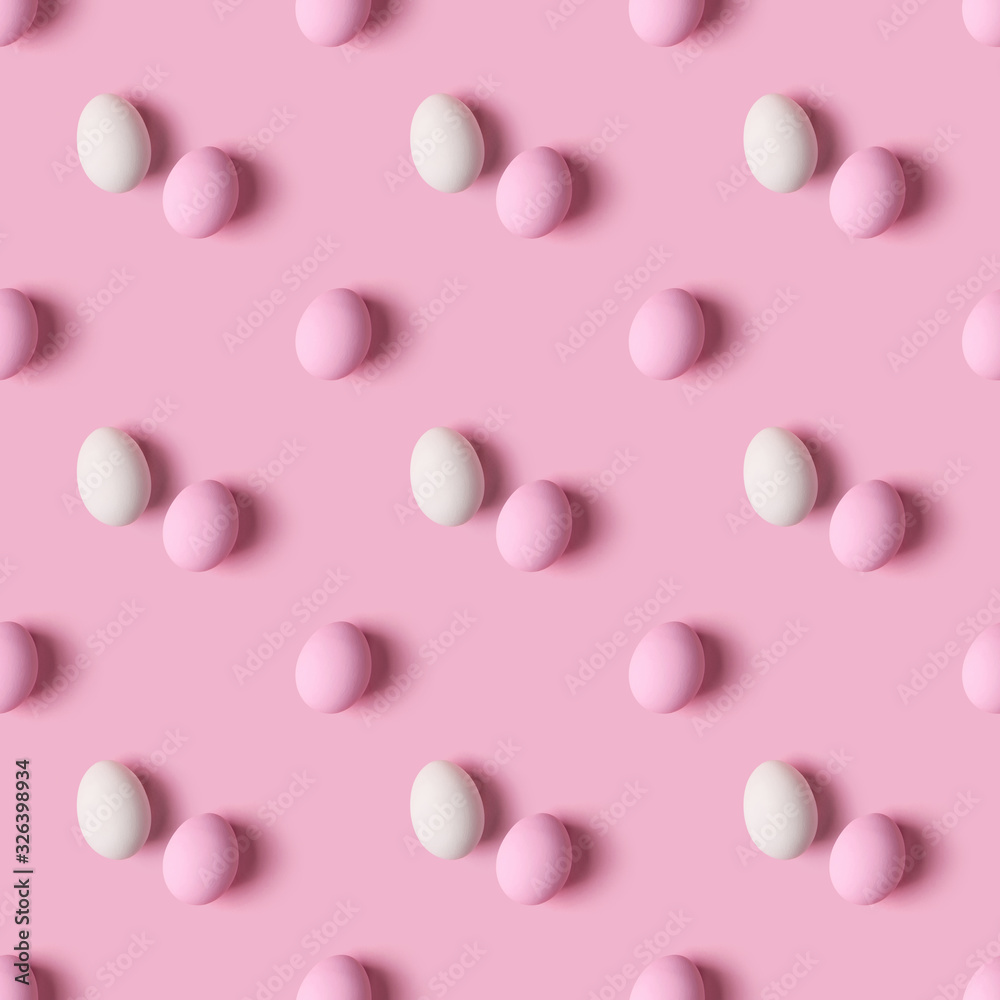 Seamless pattern of Easter eggs over pink background, top view