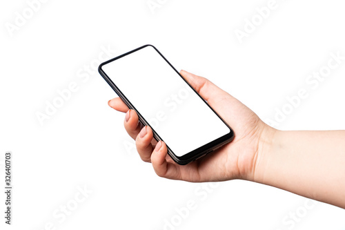 Woman hand holding and showing blank smart phone isolated on white background with clipping path around and display with copy space for your text