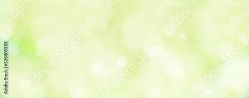 Spring background - abstract banner - green blurred bokeh lights 