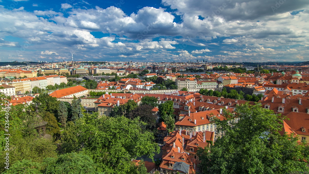 Panorama of Prague Old Town with red roofs timelapse, famous Charles bridge and Vltava river, Czech Republic.