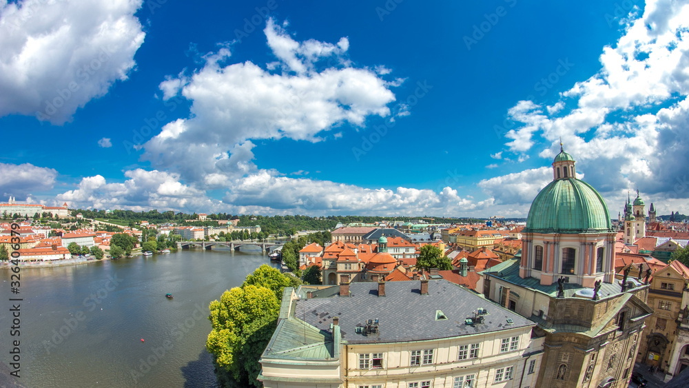 view of the manes bridge with a building of the czech parliament behind it timelapse from Old Town Bridge Tower.