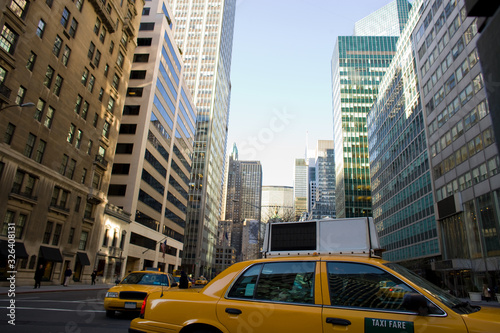Fotografering Yellow cabs on Park Avenue in midtown Manhattan, New York City, Unites States