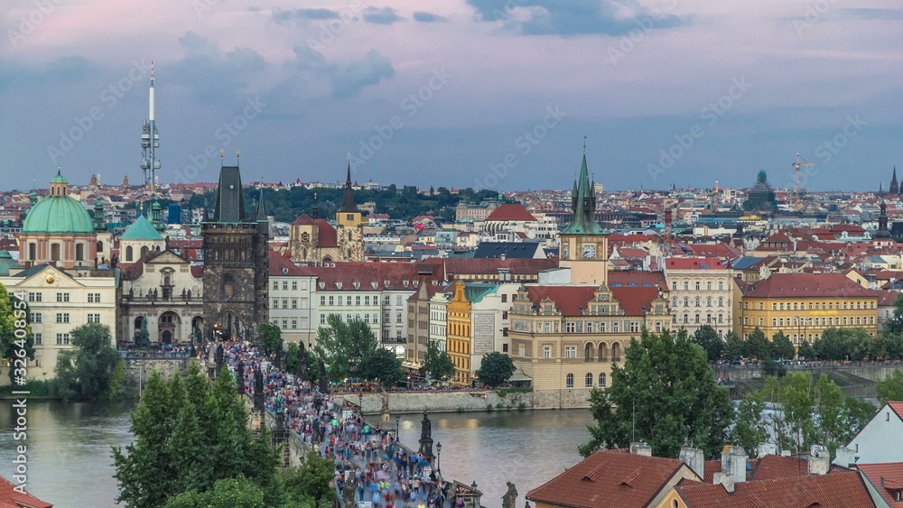 Scenic summer aerial view of the Old Town pier architecture and Charles Bridge over Vltava river timelapse in Praha. Prague, Czech Republic.