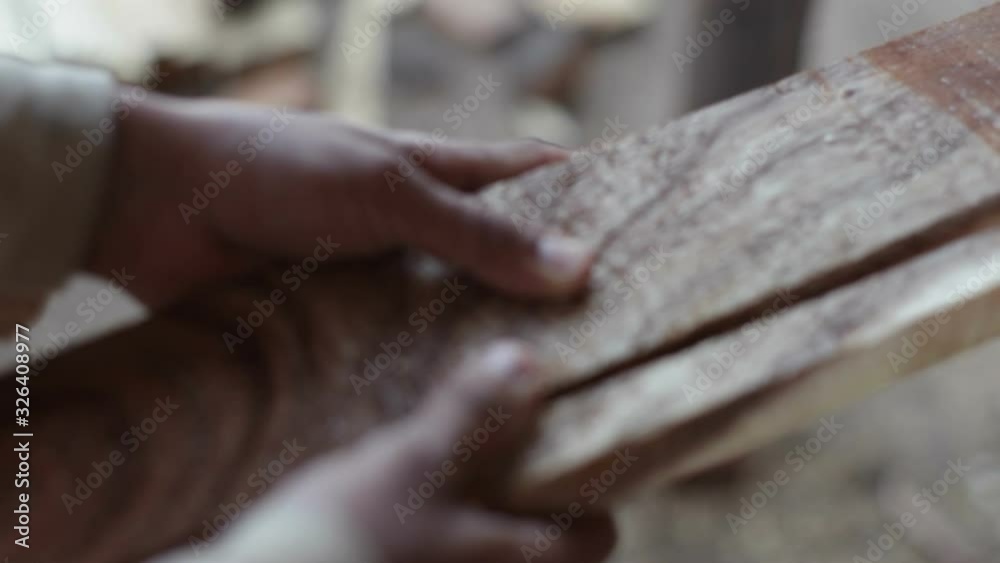 Carpenters cut wood in a sawmill, extreme close up, shallow DOF Carpenters cut wood in a sawmill, extreme close up, shallow DOF