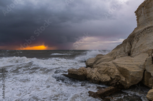 Stormy  weather in the evening at sunset on the Mediterranean coast near Rosh HaNikra in Israel photo