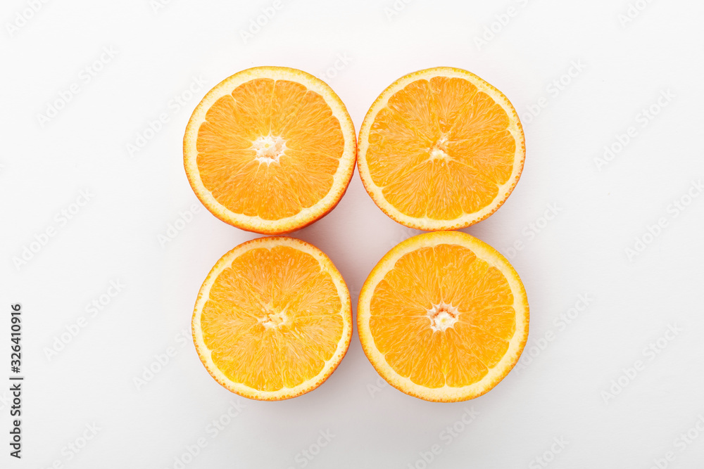 Top view of cut oranges on white background Top view of cut oranges on white background
