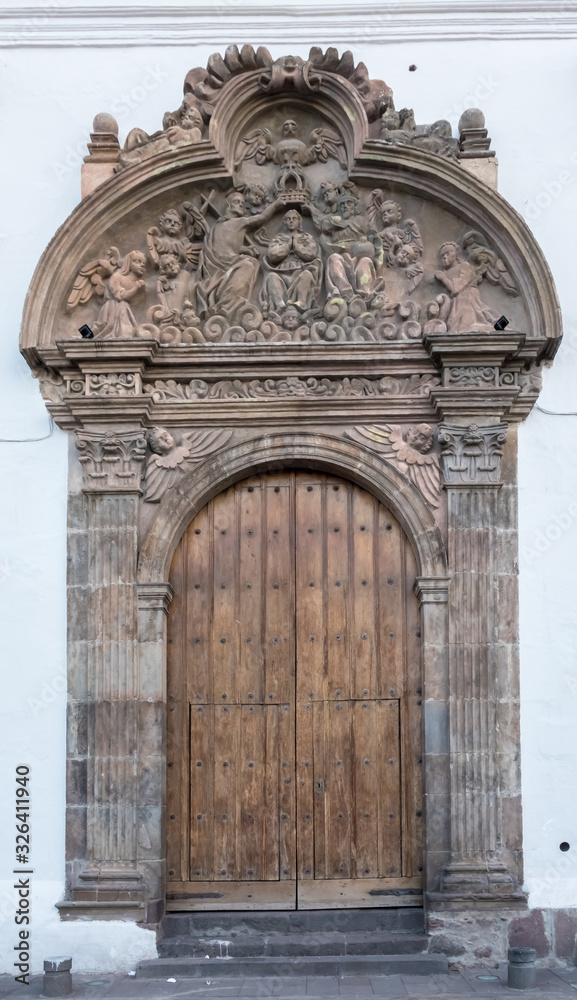 Church portal, historical center of Quito, founded in the 16th century on the ruins of an Inca city, Ecuador