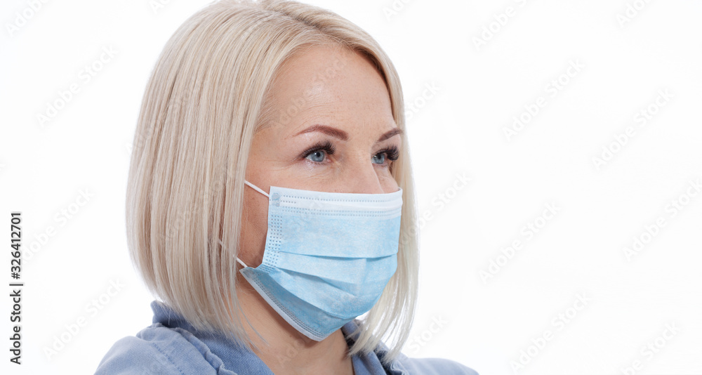Face of a woman wearing a mask. Coronavirus and Air pollution concept. Face of a woman wearing a mask. Coronavirus and Air pollution concept.