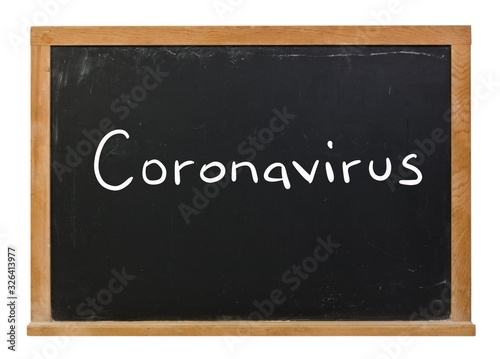 Coronavirus written in white chalk on a black chalkboard isolated on white