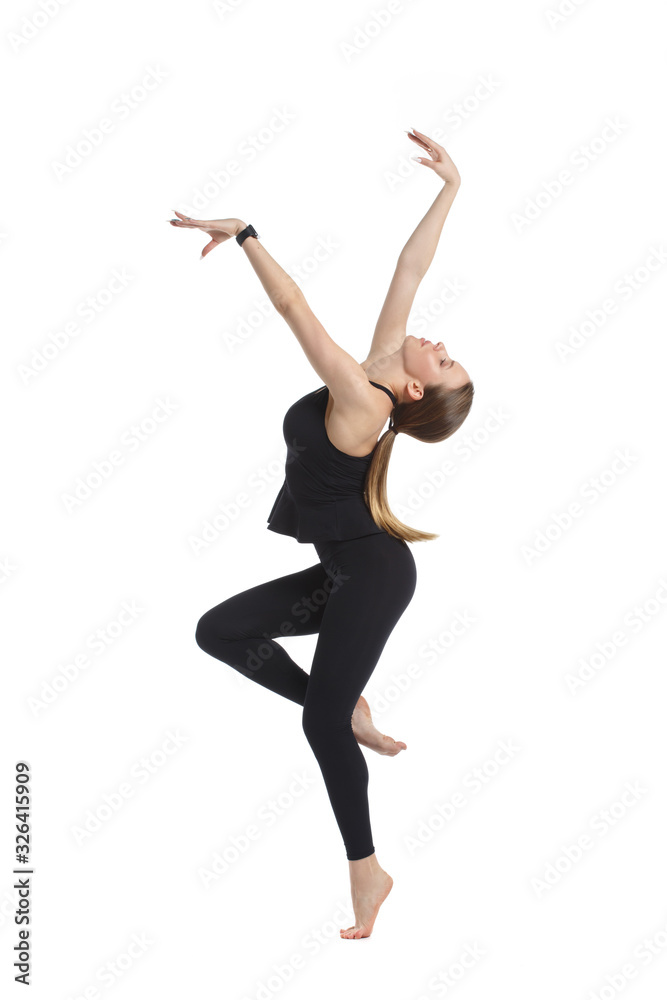 Slender girl gymnast in black sportswear with Isolated on a white background.