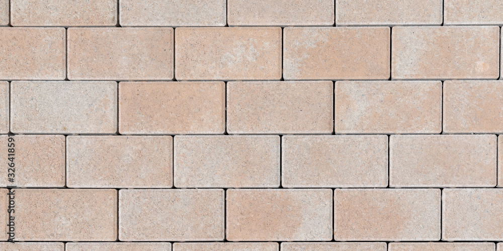 Textured stone tilled wall texture masonry brick abstract background of sandstone facade for wallpaper Textured stone tilled wall texture masonry brick abstract background of sandstone facade for wallpaper