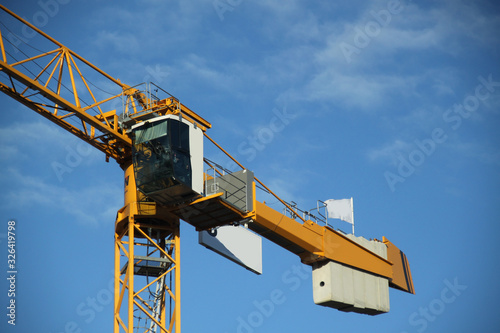 Construction yellow high crane engine
