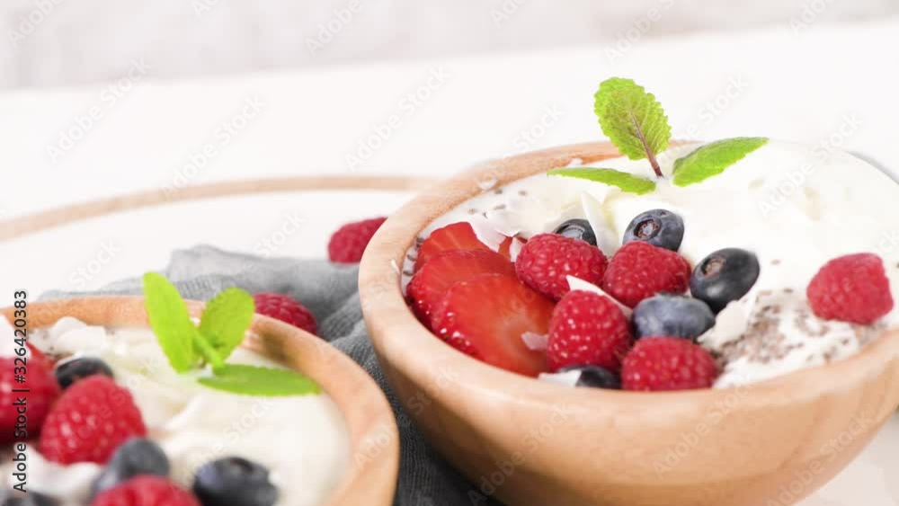 Yogurt with Chia seeds and fresh Strawberries, Raspberries, and Blueberries. Concept of Healthy Eating. Yogurt with Chia seeds and fresh Strawberries, Raspberries, and Blueberries. Concept of Healthy Eating.