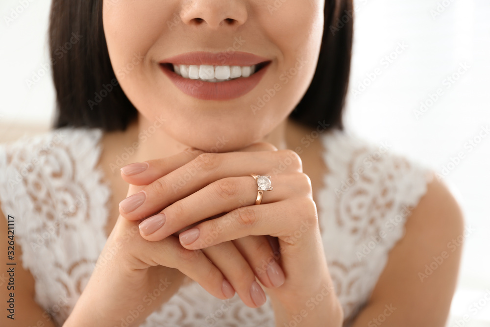 Young bride wearing beautiful engagement ring, closeup Young bride wearing beautiful engagement ring, closeup