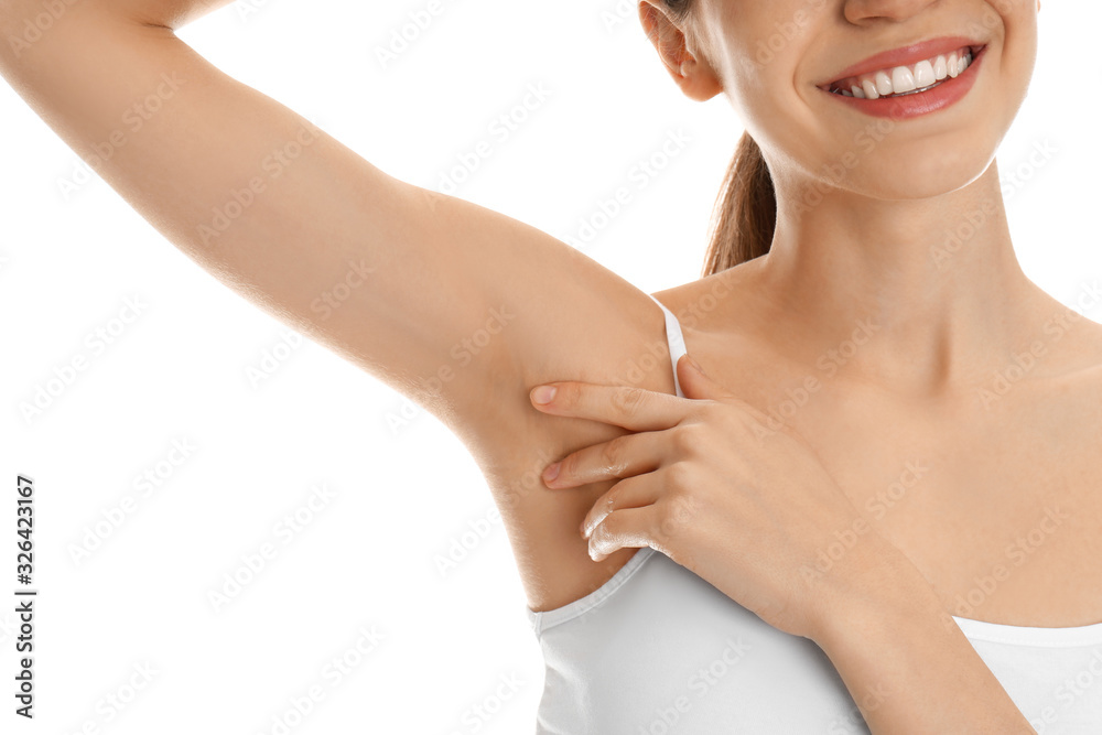 Young woman showing armpit with smooth clean skin on white background, closeup Young woman showing armpit with smooth clean skin on white background, closeup