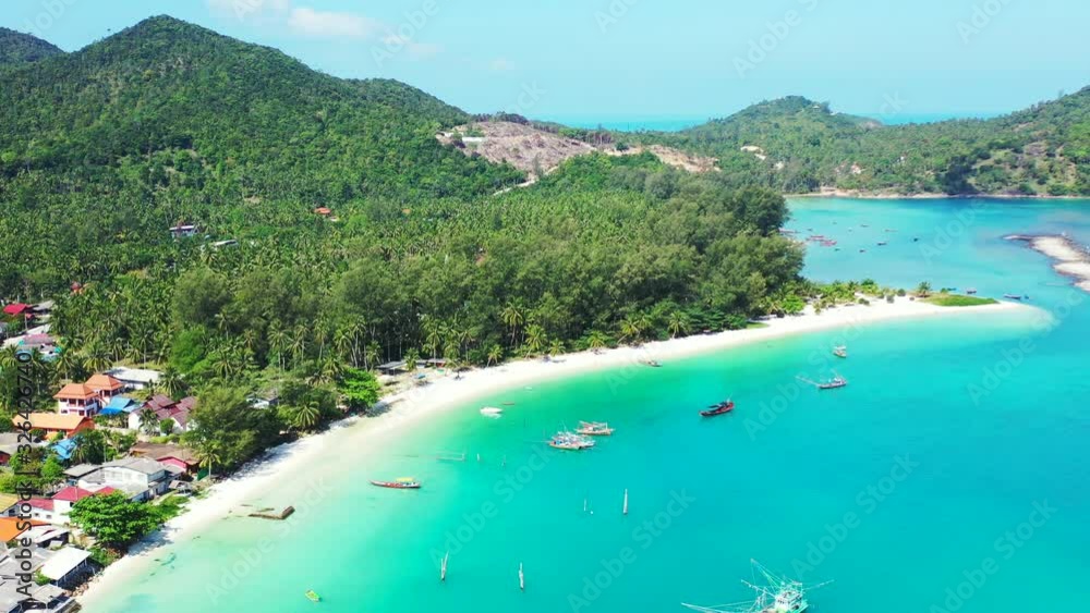 Peaceful coastline of tropical island with holiday resorts on white sandy beach washed by calm turquoise lagoon. Koh Pha Ngan, Thailand Peaceful coastline of tropical island with holiday resorts on white sandy beach washed by calm turquoise lagoon. Koh Pha Ngan, Thailand