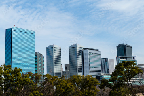 Osaka  Japan cityscape with blue sky at sunny day  copy space. beautiful of urban landscape  skyline city office buildings  on Sky clouds background.  Buildings  town  city Asia concept