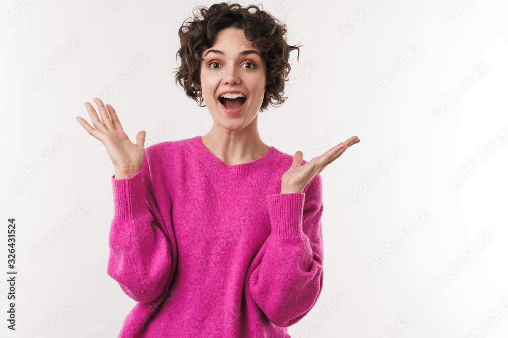 Image of excited beautiful woman expressing surprise at camera Image of excited beautiful woman expressing surprise at camera
