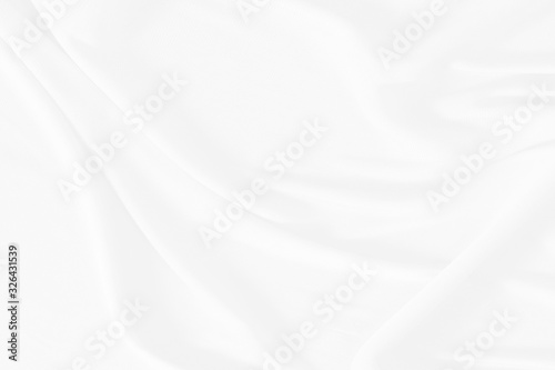 White cloth background abstract. Fabric is wrinkled and sofe wave. Material are used in textile assembly. detail texture of pattern design, elegance with free space copy for backdrop or wallpaper.