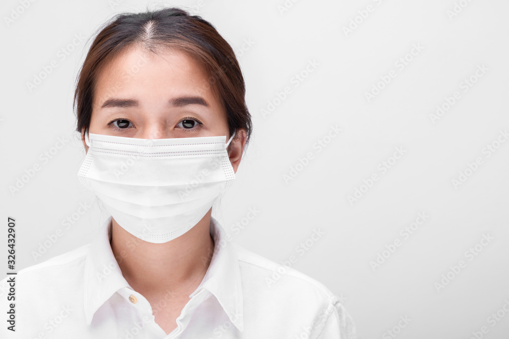 Young woman with face mask isolated on white background to prevent coronavirus & PM 2.5 air pollution, Woman demonstrate how to wear virus protective face mask. Young woman with face mask isolated on white background to prevent coronavirus & PM 2.5 air pollution, Woman demonstrate how to wear virus protective face mask.