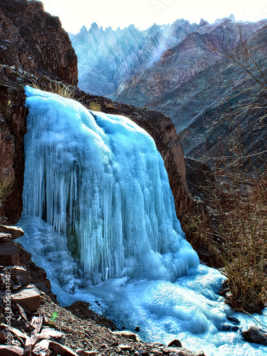 small frozen mountain waterfall close-up