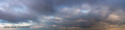 Fantastic dark thunderclouds at sunrise