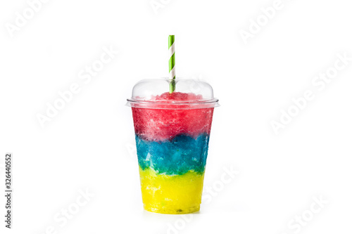 Colorful slushie of differents flavors with straw in plastic cup isolated on white background photo