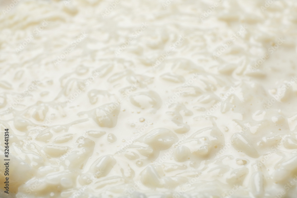 Delicious rice pudding as background, closeup view