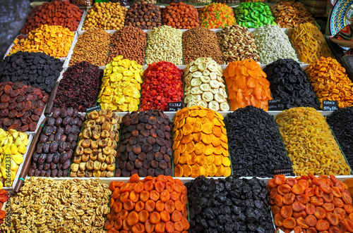 A large variety of dried fruits and nuts are on sale in the market. Tasty and healthy food.