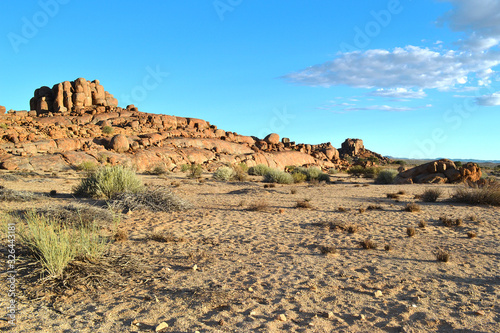 Beautiful african landscape with rocks, clumps of grass, round giant stones, Namibia.