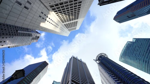 looking up view at office building architecture with blue sky in the financial district