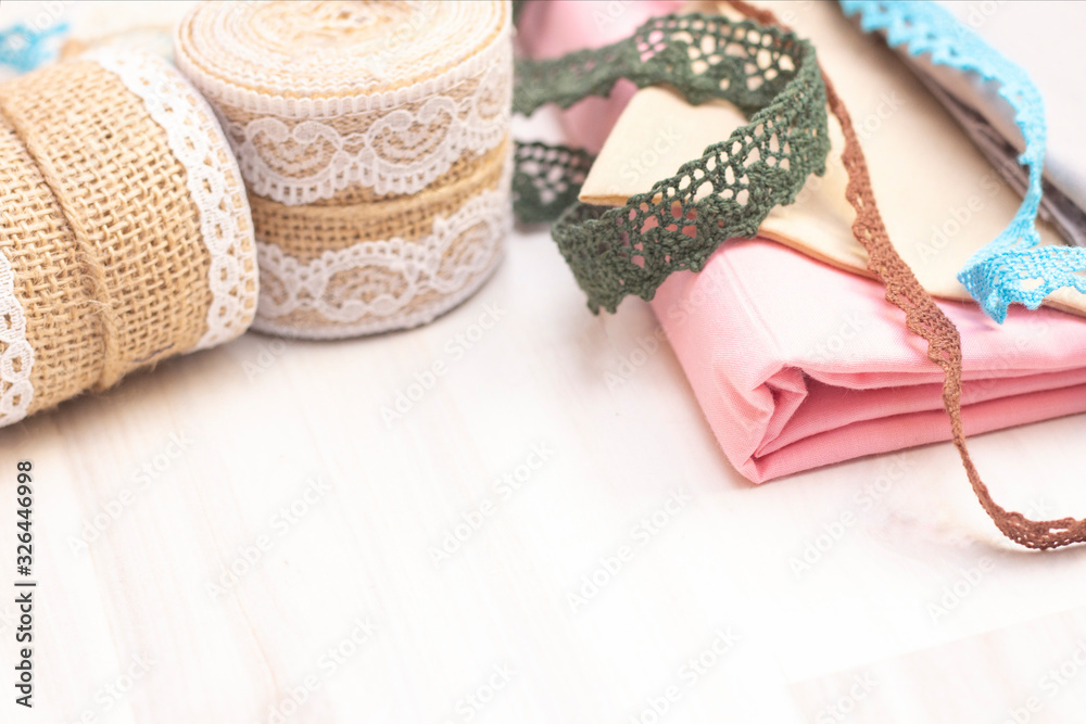 Fototapeta premium Background sewing. Ribbons, lace for sewing and creativity. Background with copy space.