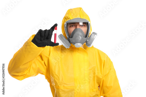 Man in chemical protective suit holding test tube of blood sample on white background. Virus research
