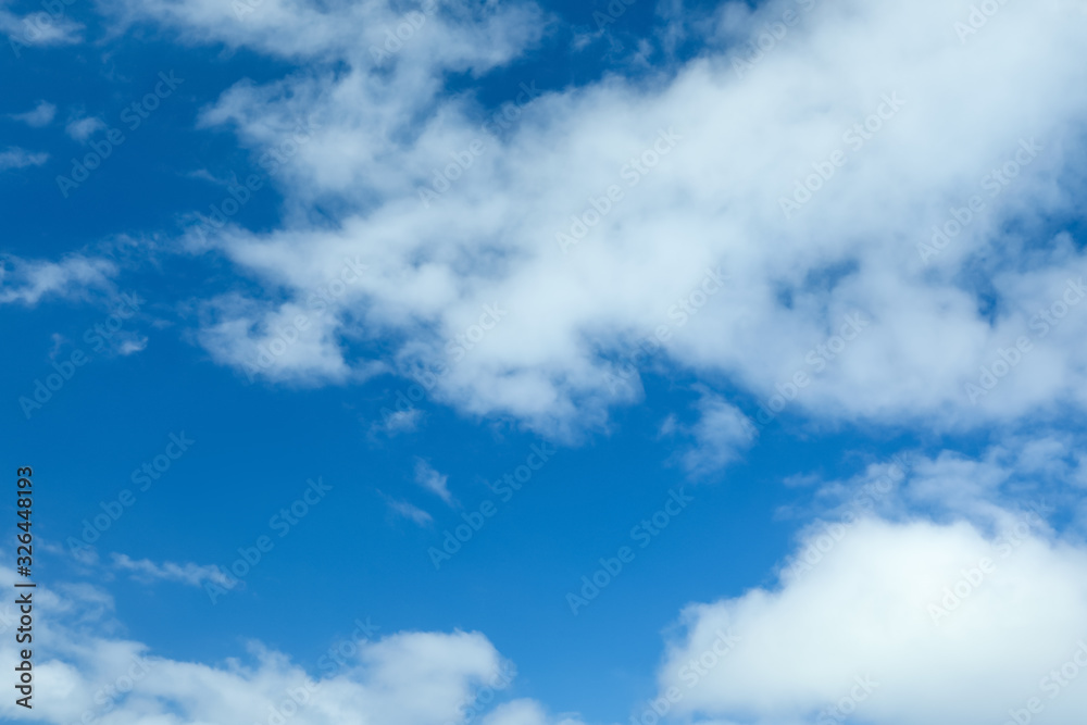 Picturesque view of beautiful blue sky with fluffy white clouds Picturesque view of beautiful blue sky with fluffy white clouds