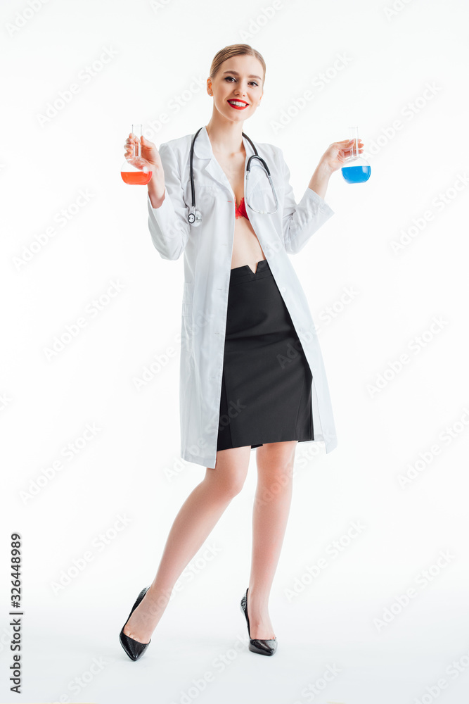 happy and sexy nurse holding flasks with red and blue liquid on white happy and sexy nurse holding flasks with red and blue liquid on white
