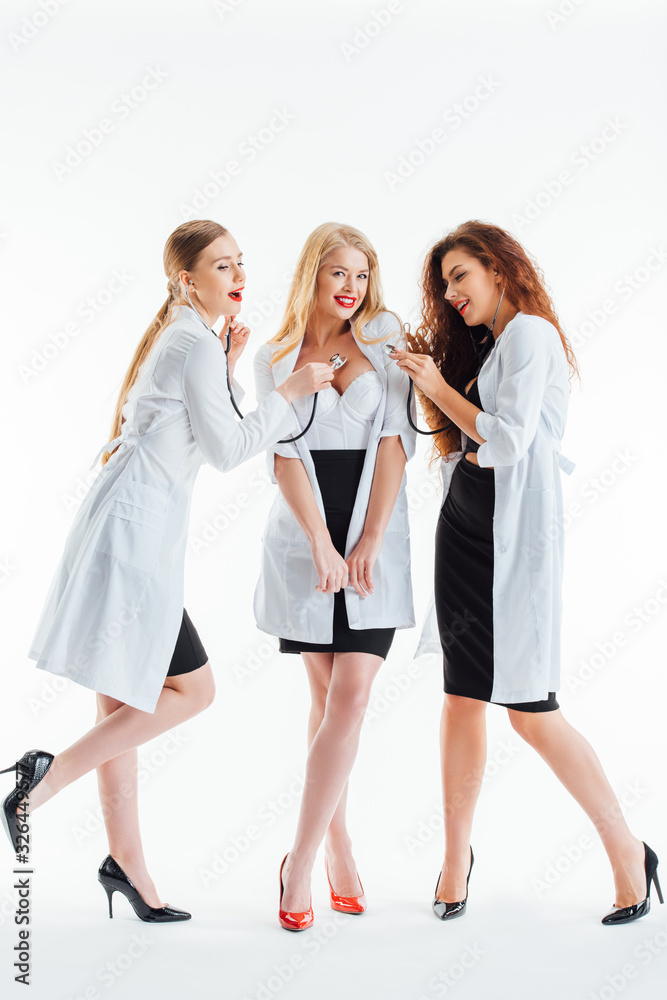 sexy nurses examining cheerful girl on white sexy nurses examining cheerful girl on white