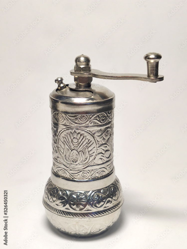 Spice and pepper mill on a white background. Spice and pepper mill on a white background.