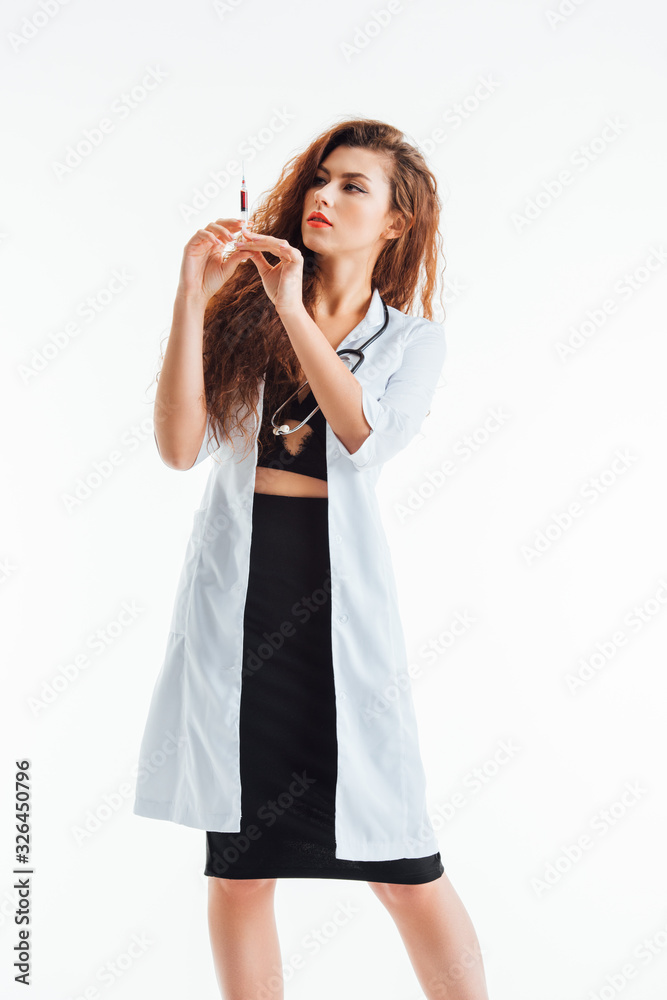 curly and sexy nurse holding syringe isolated on white curly and sexy nurse holding syringe isolated on white